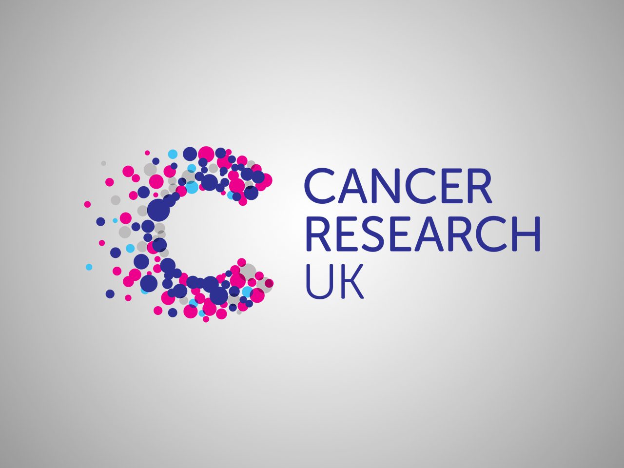 Cancer Research UK logo with a stylised 'C' made of multicoloured dots and the organisation's name in blue text on a grey background.
