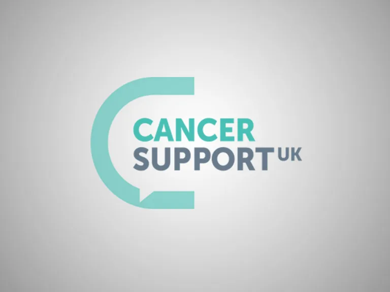 Cancer Support UK logo with a circular speech bubble design and the organisation's name in teal and grey text on a light grey background.