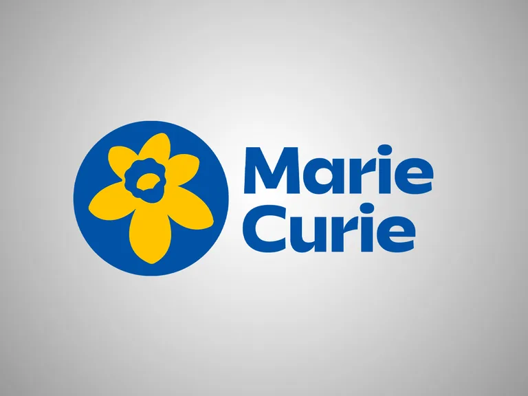 A logo with a blue circle containing a yellow flower and the text "Marie Curie" in bold blue font on a light grey background.