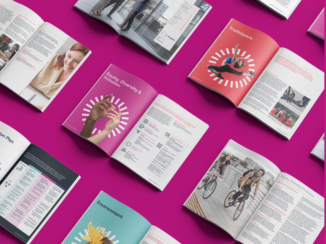 Open magazines featuring diverse content, including images of people, text, and colourful backgrounds, displayed on a bright pink surface.