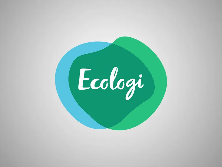 A colourful logo with the word "Ecologi" in white cursive text, featuring overlapping green and blue circular shapes on a light grey background.