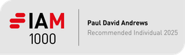 A badge with the text "I AM 1000" in black and red, alongside the name "Paul David Andrews" and the phrase "Recommended Individual 2025" on a grey background.