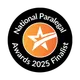 Black circular badge with a white star and orange gradient background. Text reads 'National Paralegal Awards 2023 Finalist' surrounding the symbol.