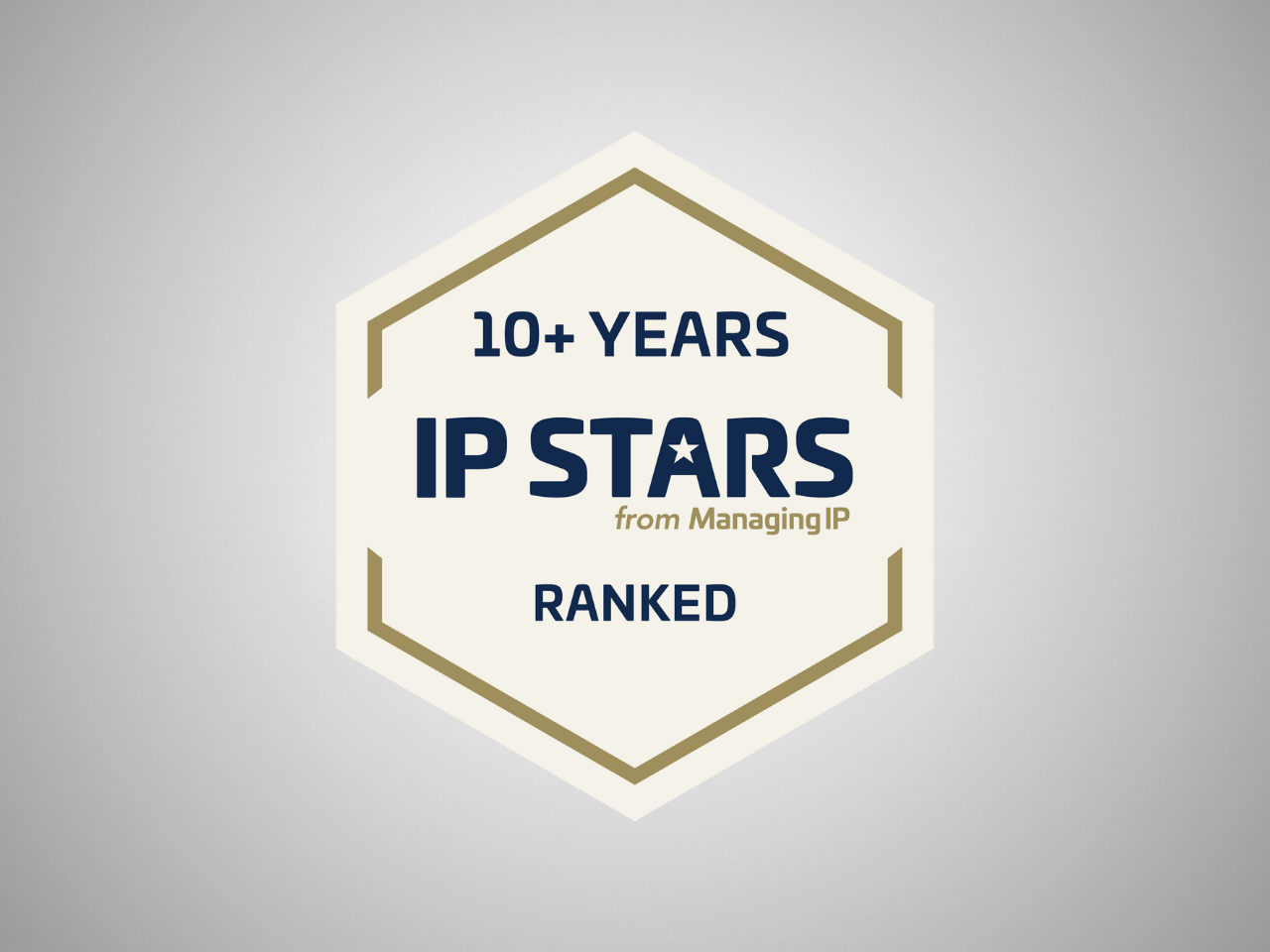 Hexagon badge with text celebrating over 10 years of IP Stars from Managing IP, ranked, on a light grey background.