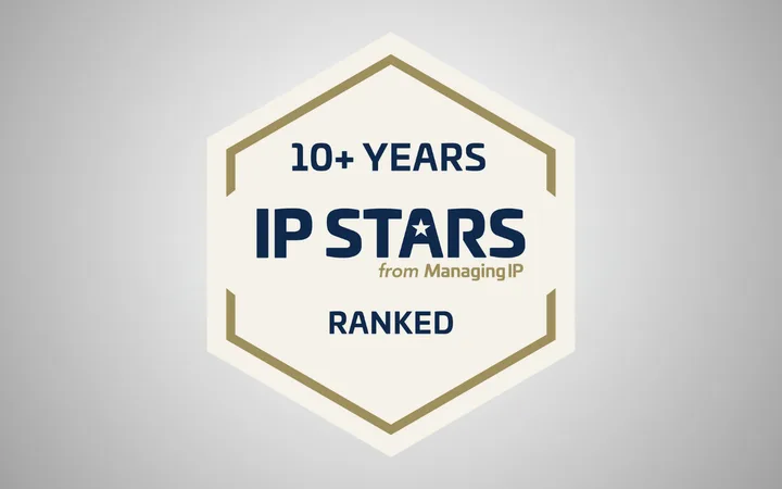 Hexagon badge with text celebrating over 10 years of IP Stars from Managing IP, ranked, on a light grey background.