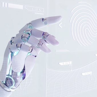 A pale robotic hand reaches forward beside a translucent futuristic interface featuring holographic graphs and a glowing fingerprint outline.