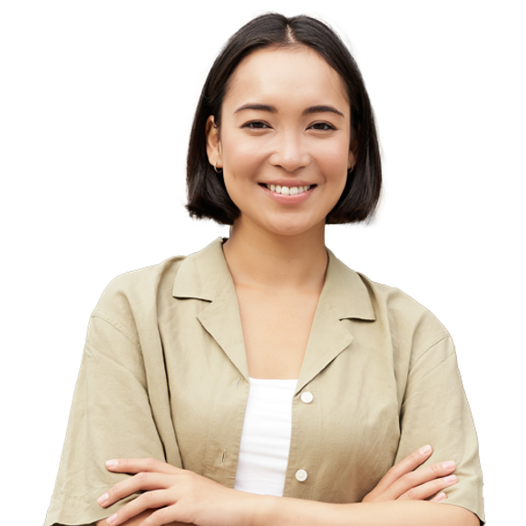 Portrait of a person with short dark hair, wearing a beige shirt over a white top, smiling with arms crossed.