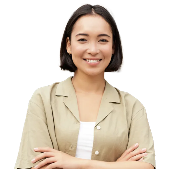 Portrait of a person with short dark hair, wearing a beige shirt over a white top, smiling with arms crossed.