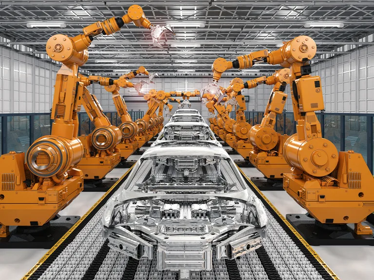 Assembly line with robotic arms working on car bodies in a modern manufacturing facility.