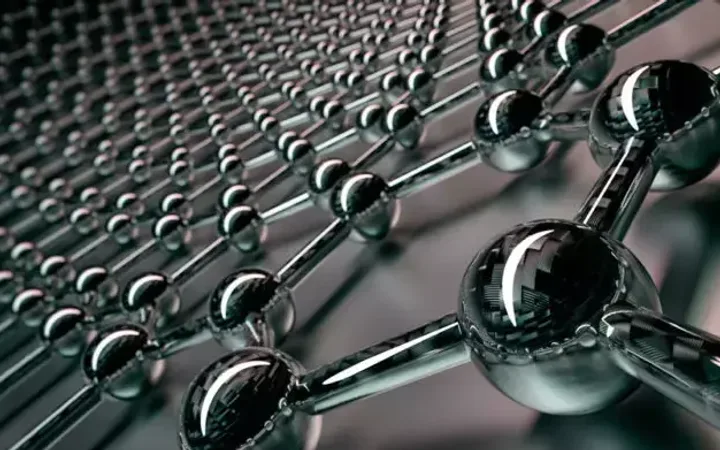 Close-up of a nanoscale metallic molecular structure with interconnected spherical atoms in a grid pattern.