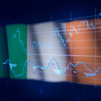 Businessman in a suit interacts with a digital trading interface featuring stock charts, buy and sell options, and financial icons.