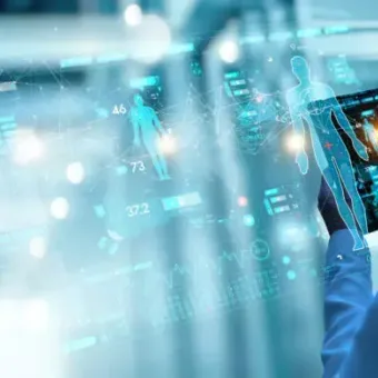 A healthcare professional in a white coat uses a tablet to interact with holographic medical data and futuristic digital health interfaces.