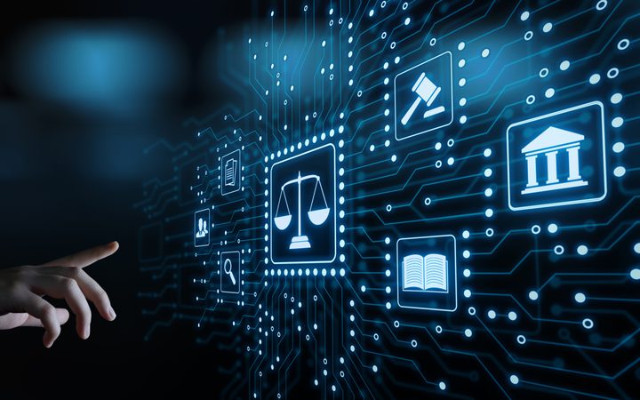 A digital interface with icons representing law, justice, and government, surrounded by interconnected lines on a dark background, with a human hand reaching for it.