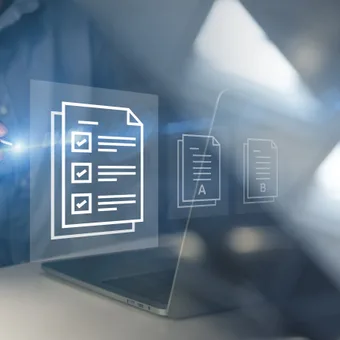 A person in a blue shirt interacts with floating digital document icons, including checked checklists and text documents, over a laptop screen.