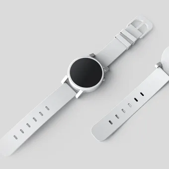Deux montres en acier inoxydable avec bracelets blancs, vues en diagonale sur fond gris clair.