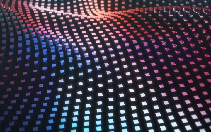 A digital abstract with a grid of illuminated squares in pink, purple, and blue shades, creating a wave-like pattern on a dark background.