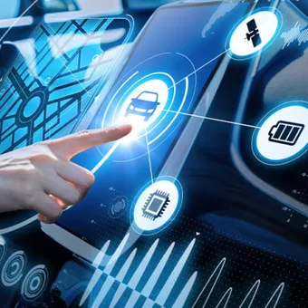 A person interacts with a futuristic touchscreen display inside a vehicle, showing icons for navigation, car control, battery, and communication.