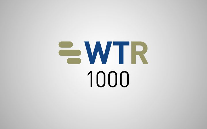 WTR 1000 logo with a grey background, featuring stylised horizontal lines and bold text in navy blue and olive green.