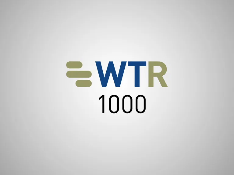 WTR 1000 logo with a grey background, featuring stylised horizontal lines and bold text in navy blue and olive green.