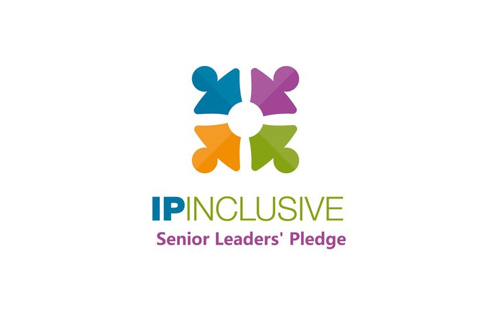 A multicoloured logo with four abstract human figures forming a circle, accompanied by the text "IP INCLUSIVE Senior Leaders' Pledge" in blue, green, and purple.