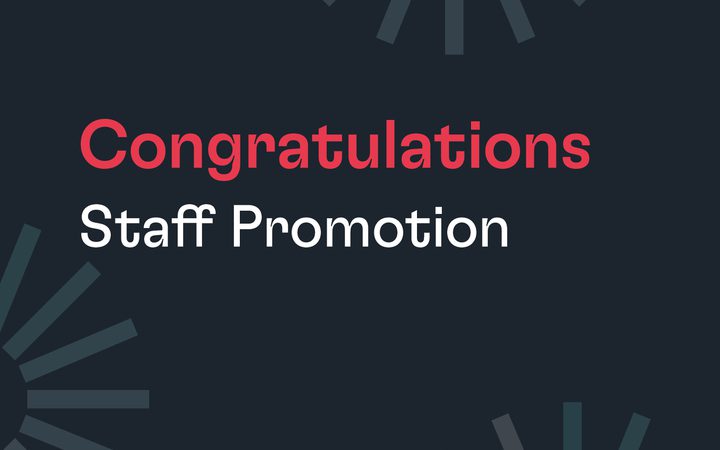 Congratulations on staff promotion with a dark background and geometric design elements in shades of grey and blue.
