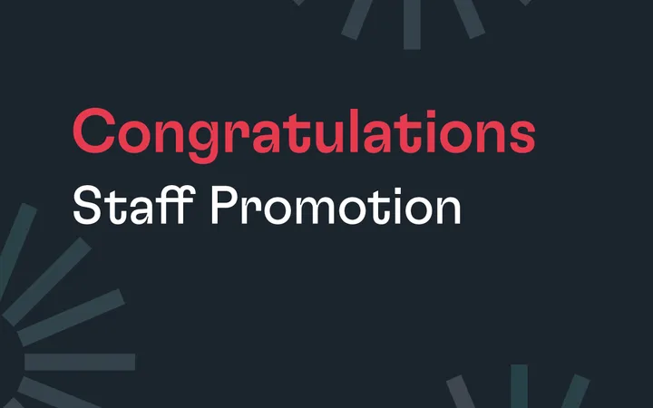 Congratulations on staff promotion with a dark background and geometric design elements in shades of grey and blue.