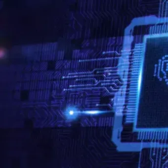 Digital circuit with a glowing blue brain symbol inside a microchip, representing artificial intelligence and technological innovation.